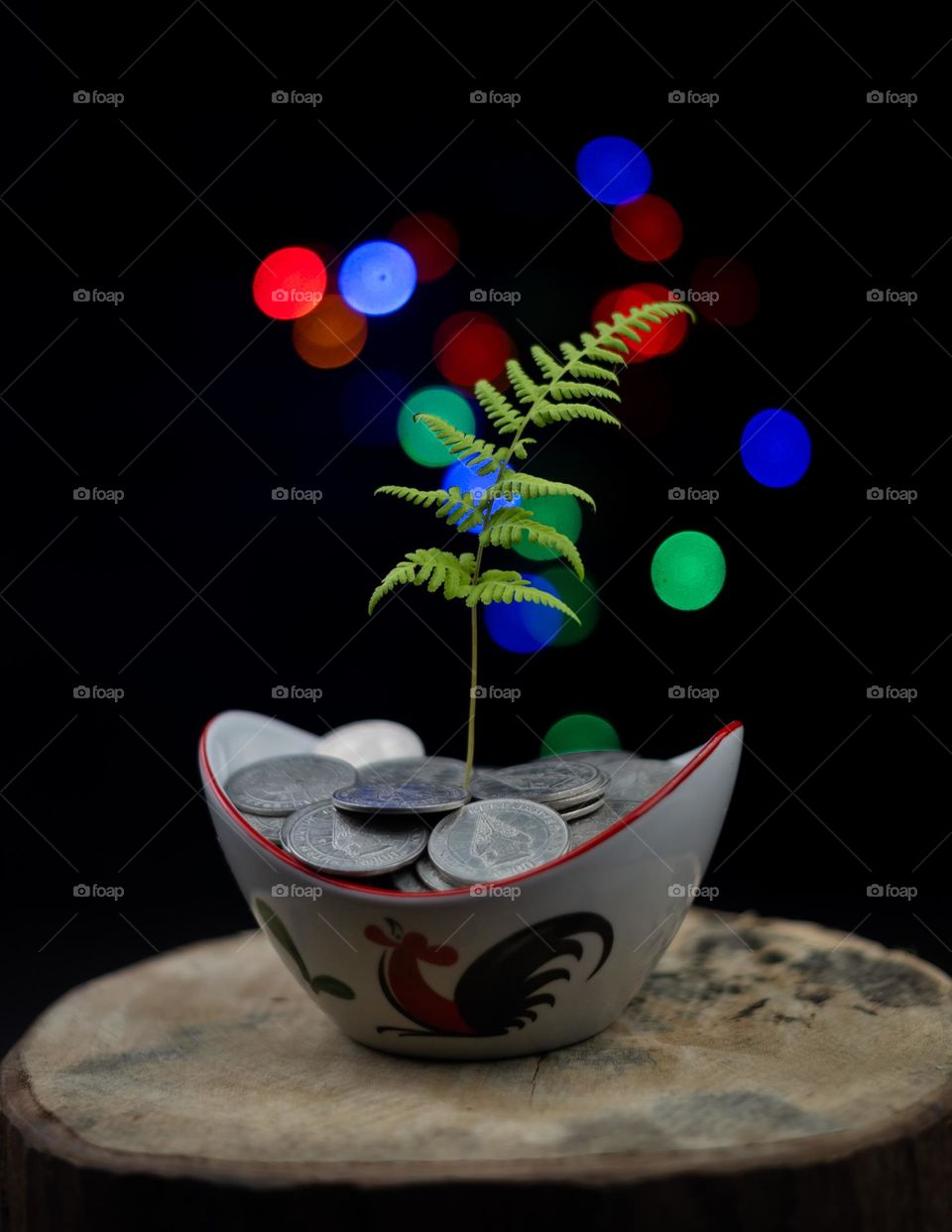 a bowl of coins and plants growing in it as an investment growth concept from a bowl of coins to more and more and growing