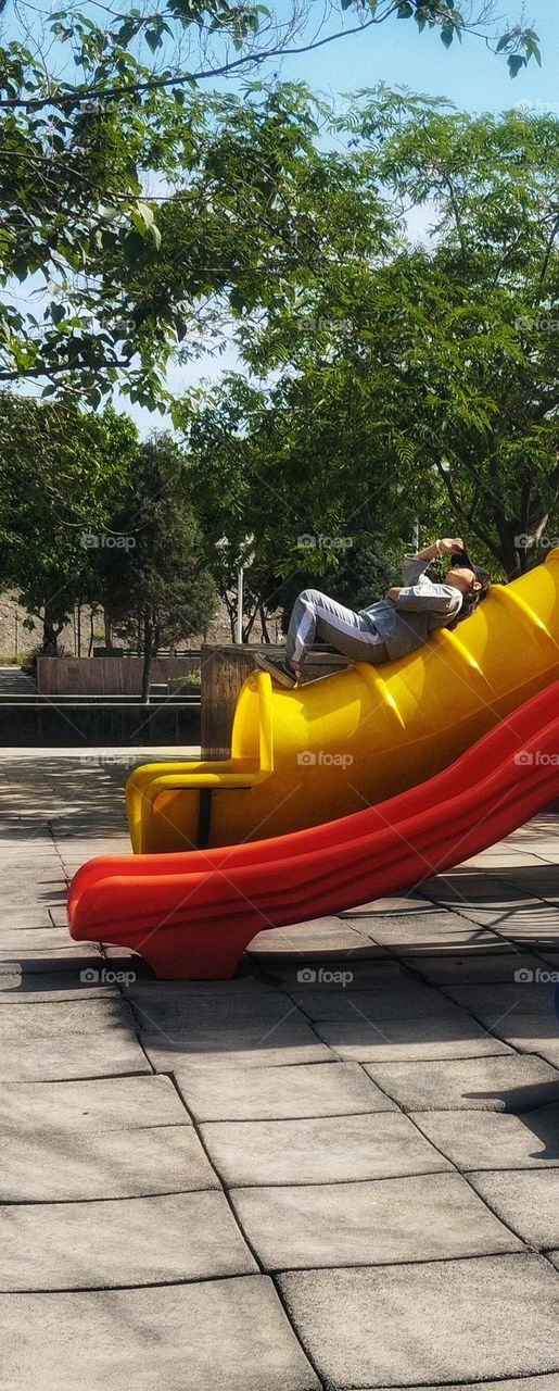 Summer time , cute teenage and slide