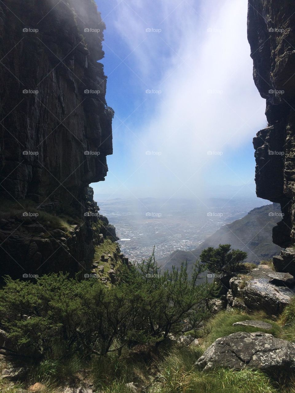 Cloud between the rocks at the mountain