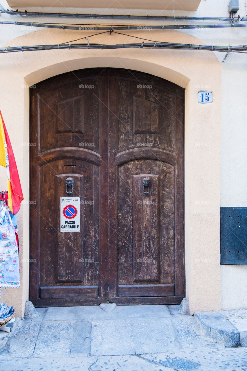 Old door in the city of Cefalu on Cicily.