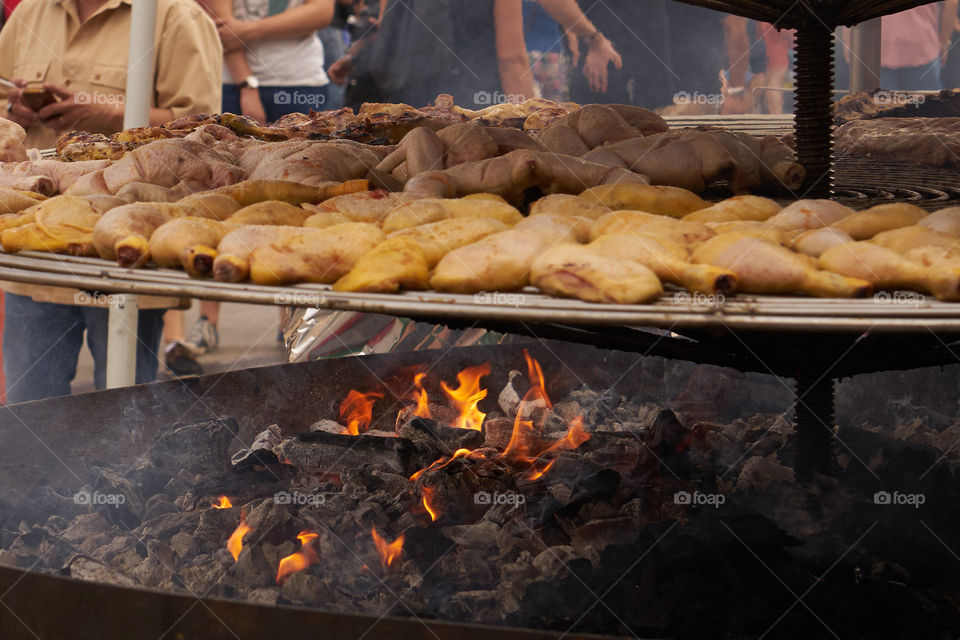 Cooking chicken on barbeque grill