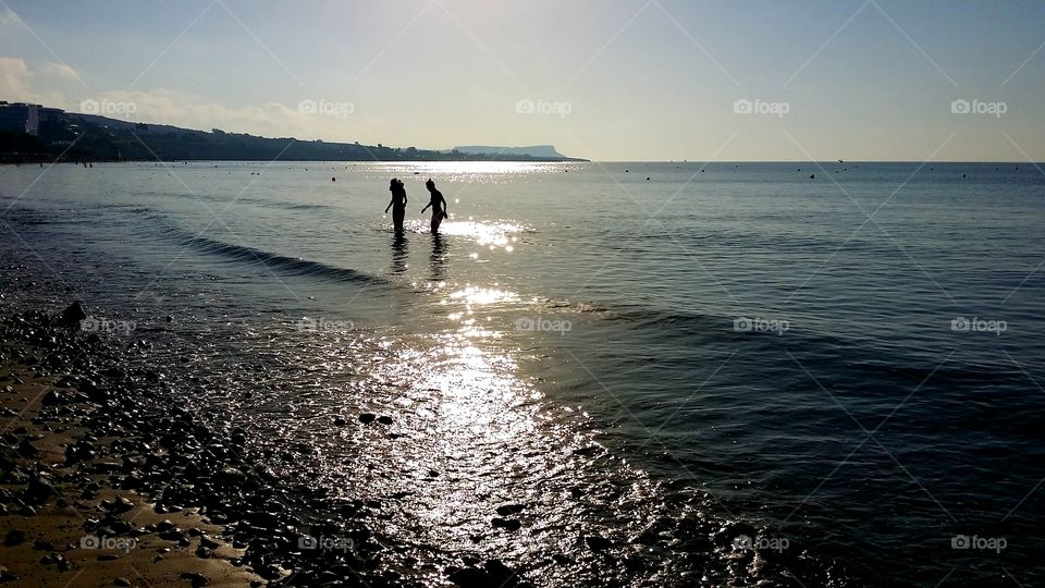 walking on the beach at sunset