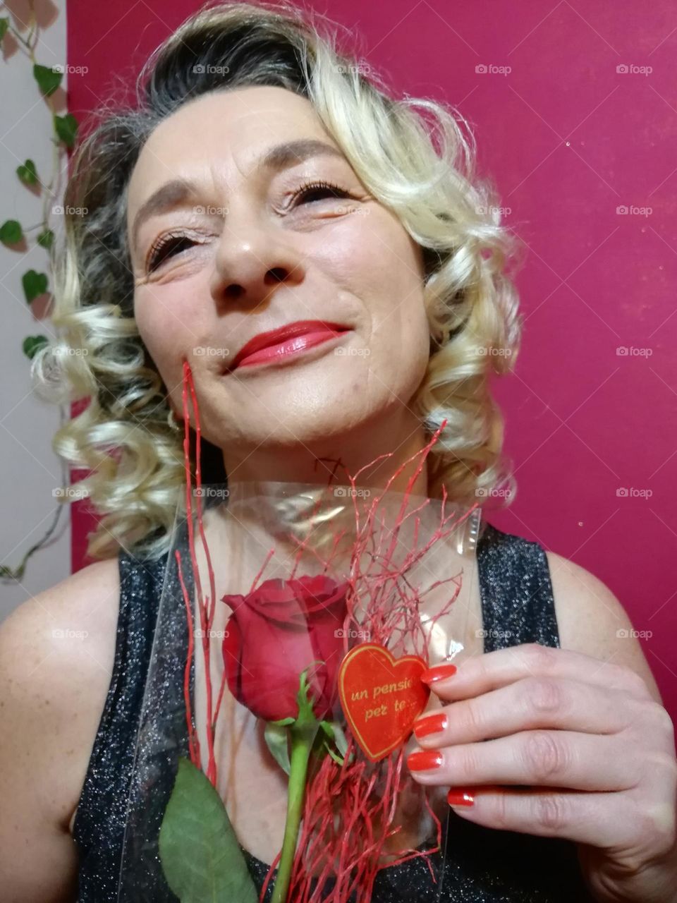 blonde woman with red roses