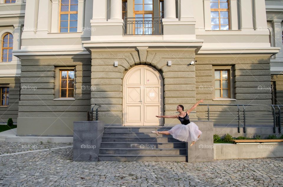 Young Female Ballerina Dancing Outside