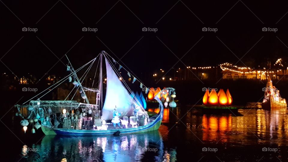 A ship makes its way out into the waters of Discovery River during Rivers of Light at Animal Kingdom at the Walt Disney World Resort in Orlando, Florida.