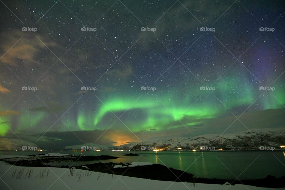 Dancing Northern Lights over the lake