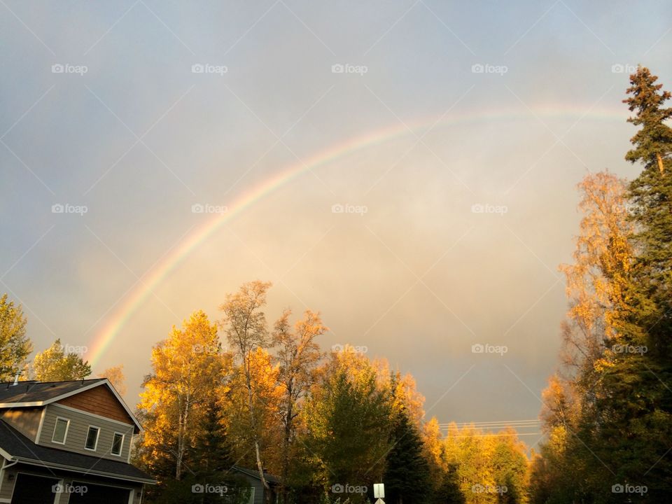 Anchorage rainbow. Photograph of a rainbow over a housing development in Anchorage, AK.