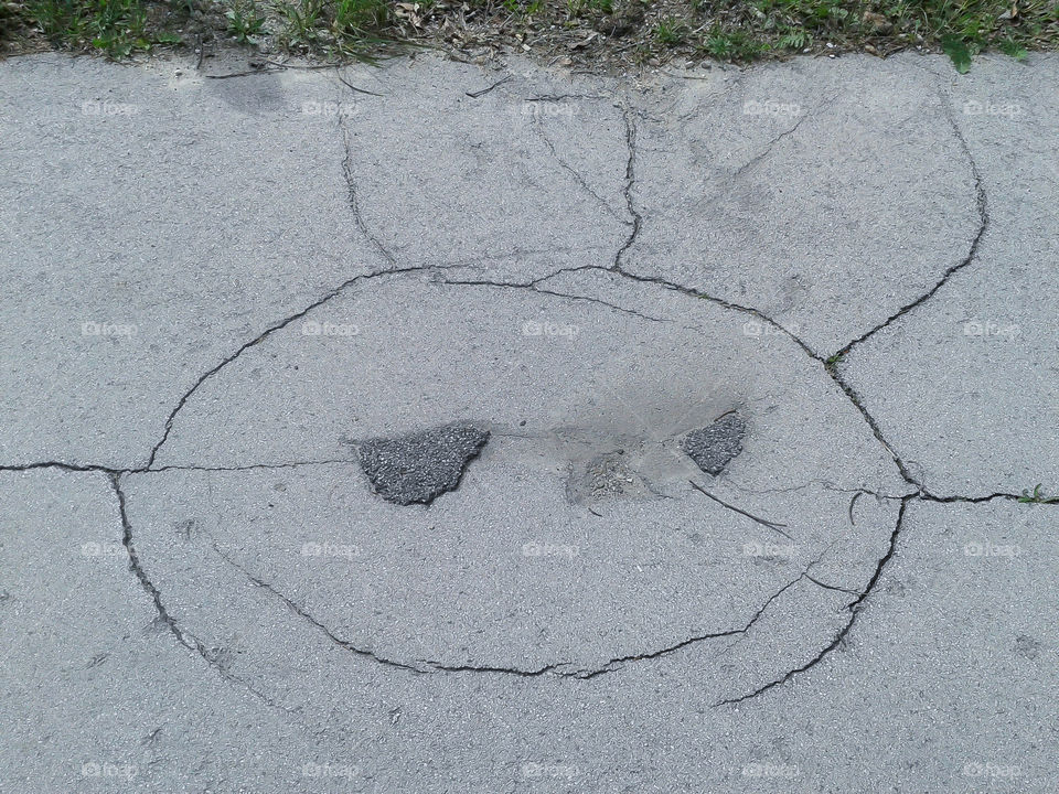 The First Emoji! Broken road looks like a face
