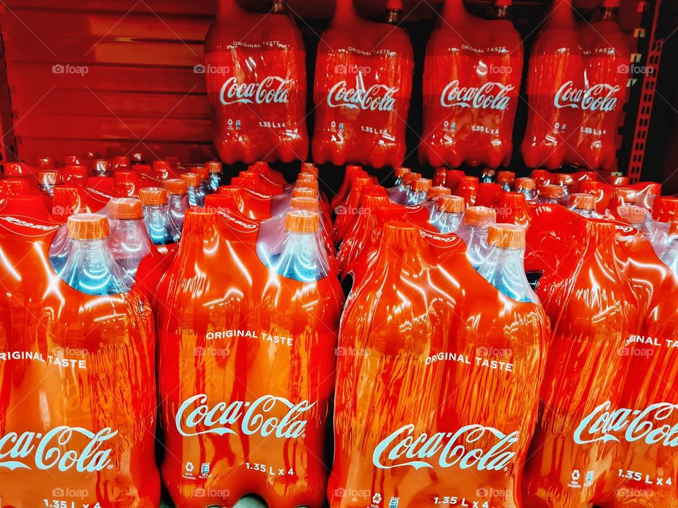 Coca Cola bottles stocked at the supermarket