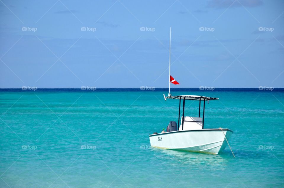 Boat at caribbean green blue sea
