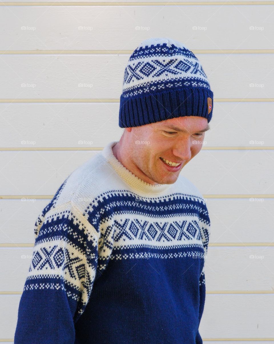 Smiling and happy man ,with knitted hat and sweather ,happy and Nice. looking good as a model