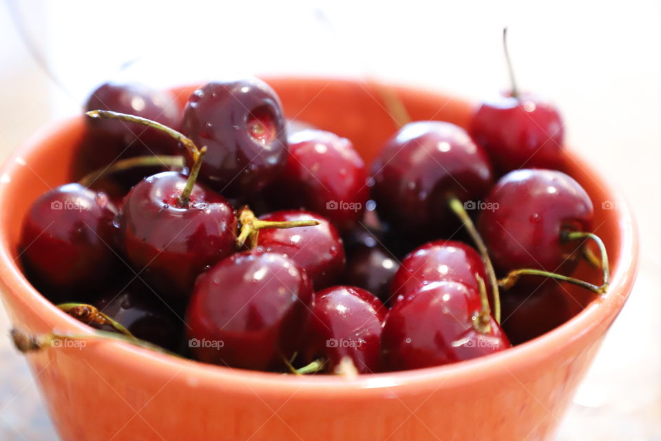 Cherries in a red bowl 