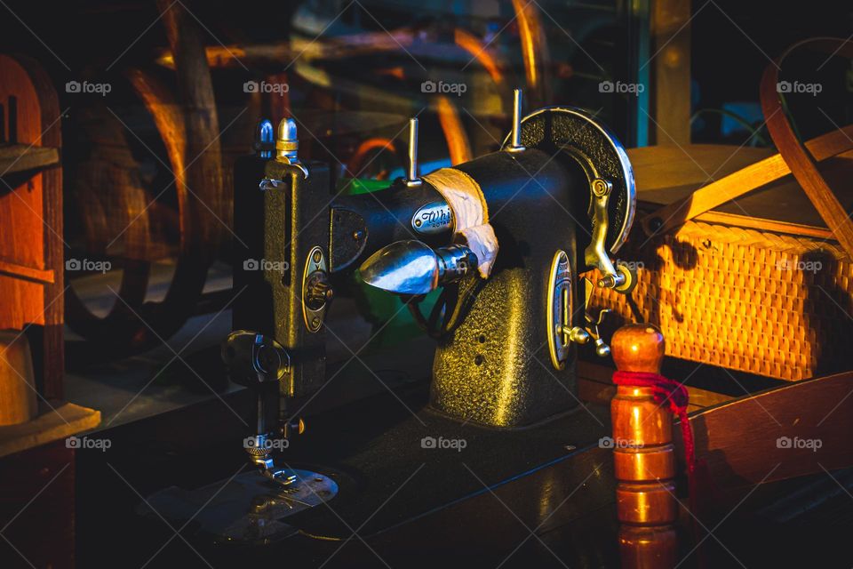Old sewing machine in front of shop