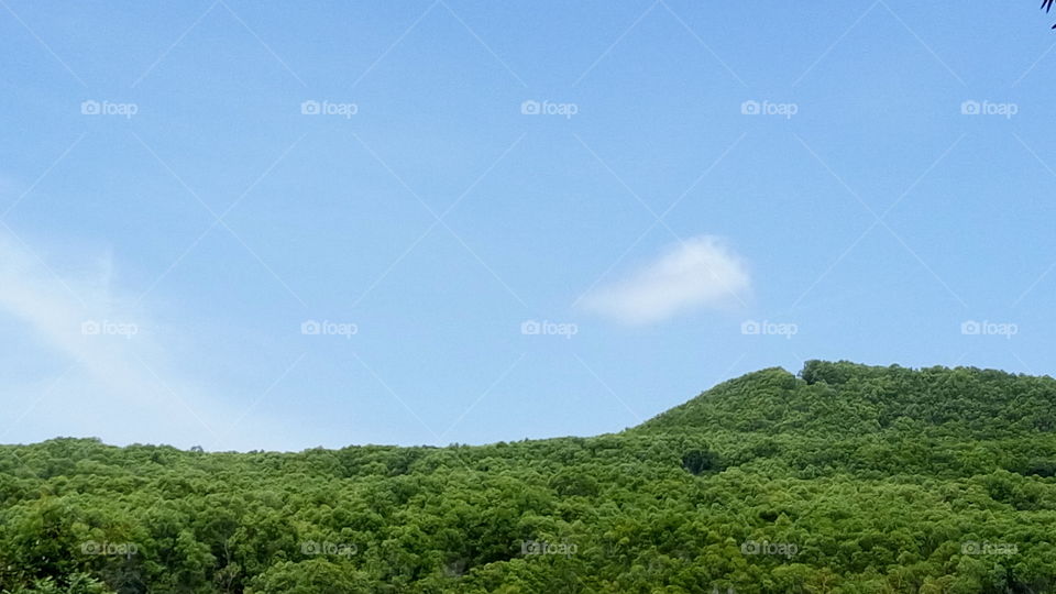 blue sky green hill