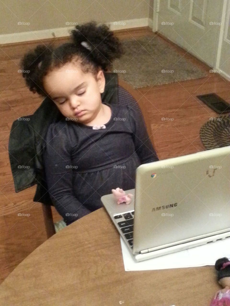 Cat nap. After a hard day at the zoo, she just couldn't last too long to watch her Dora