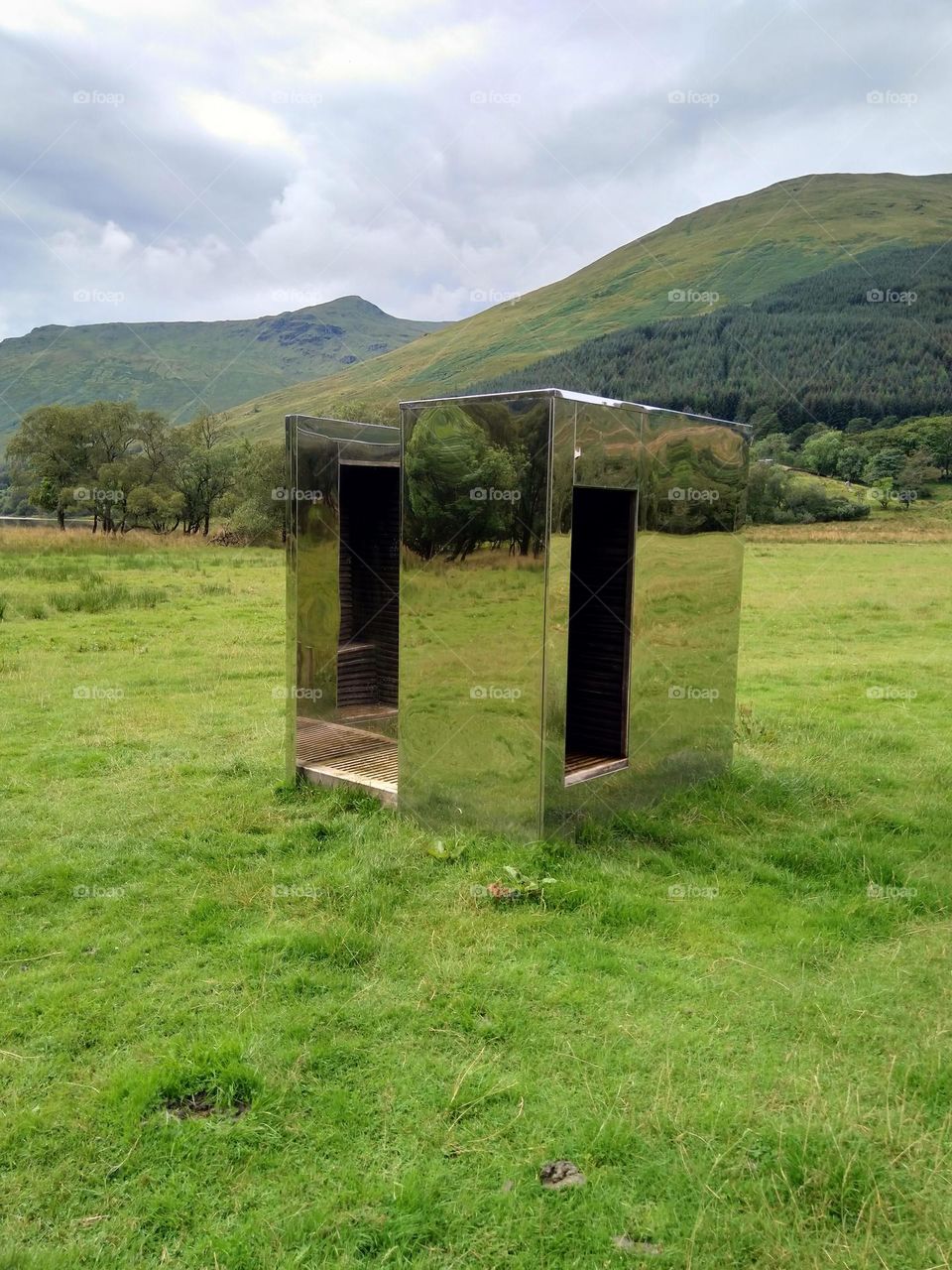 mirrored box in national park loch Lomond reflecting the surrounding scenery