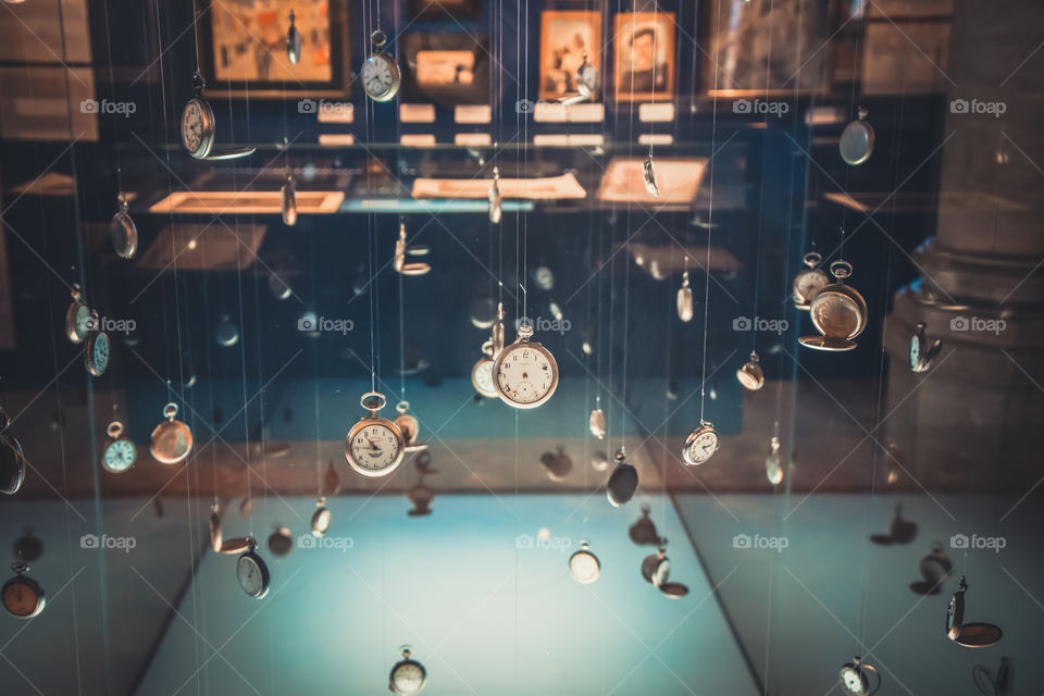 Hanging Vintage Antique Pocket Watches In A Museum Exhibition
