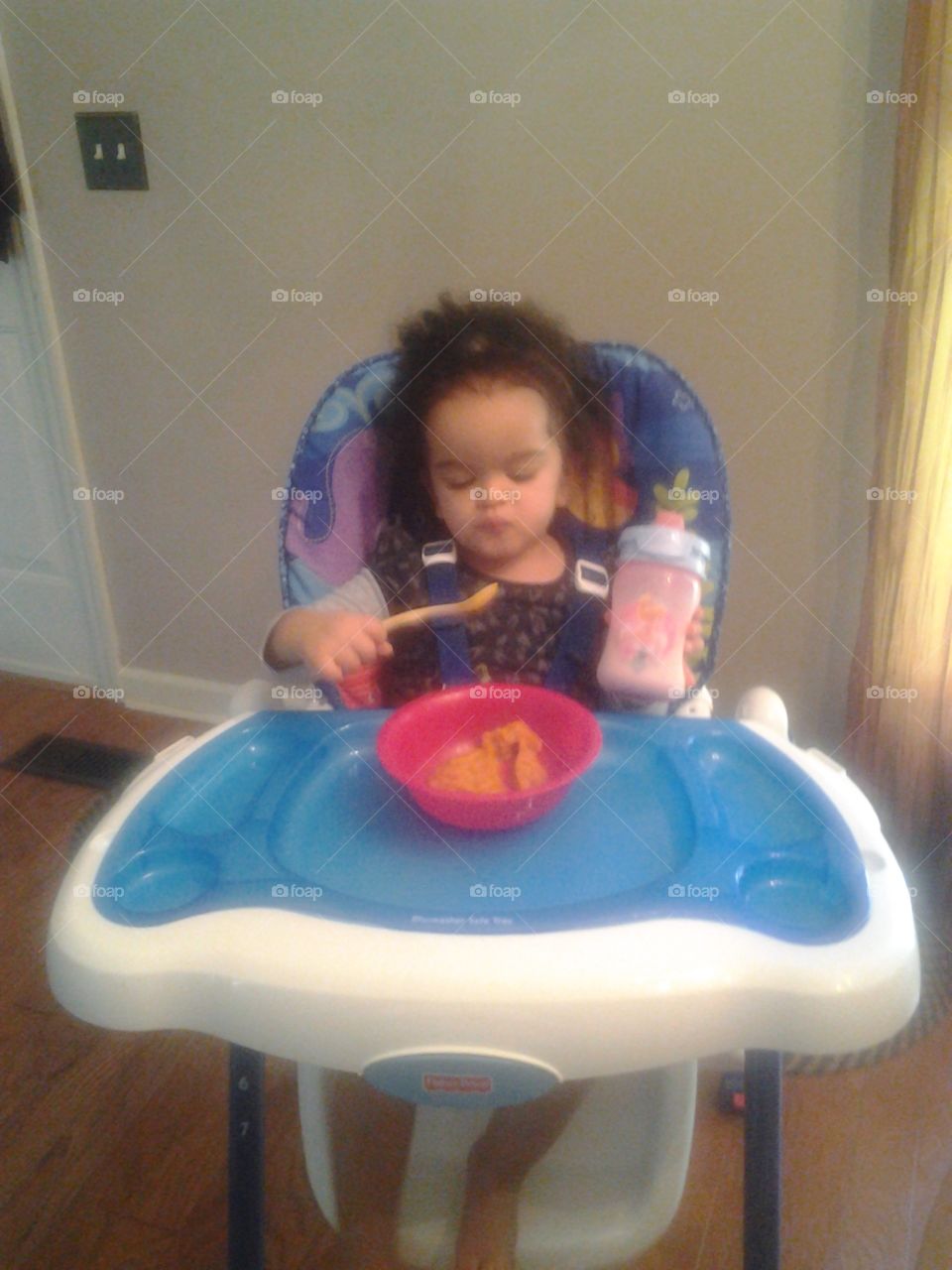 Sweet potato. Carmen feeding herself with a spoon for the first time