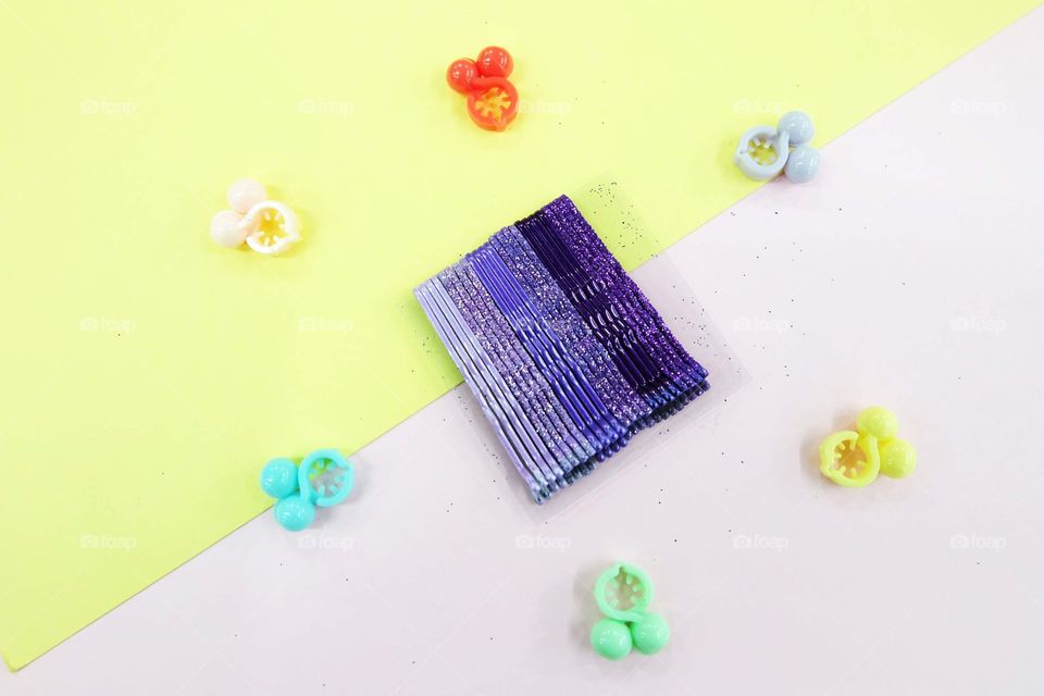 Hair Accessories Violet Hairpin Set. Fashion Purple Hair Clips Isolated on Pink and Yellow Background Great for Any Use.