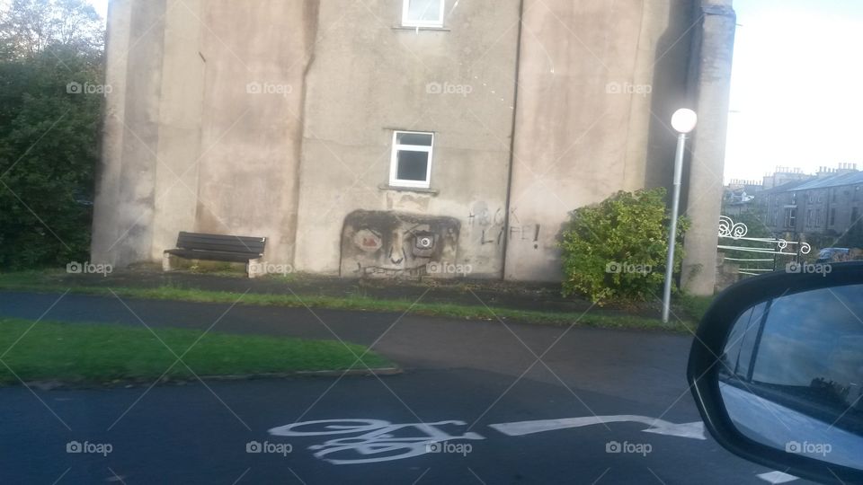 interesting graffiti found against a wall in a small English town