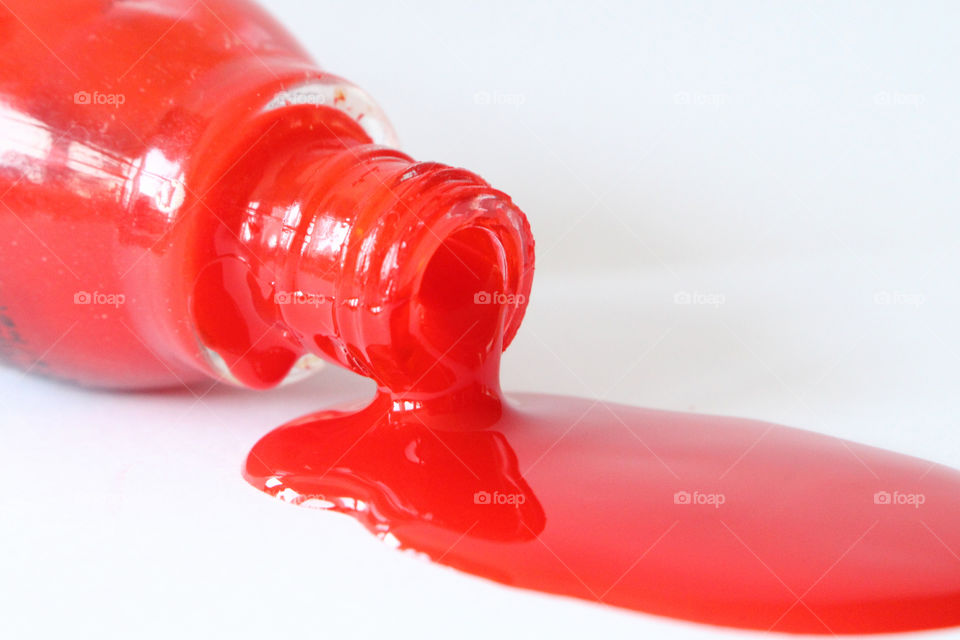 Nail polish spilling out of bottle
