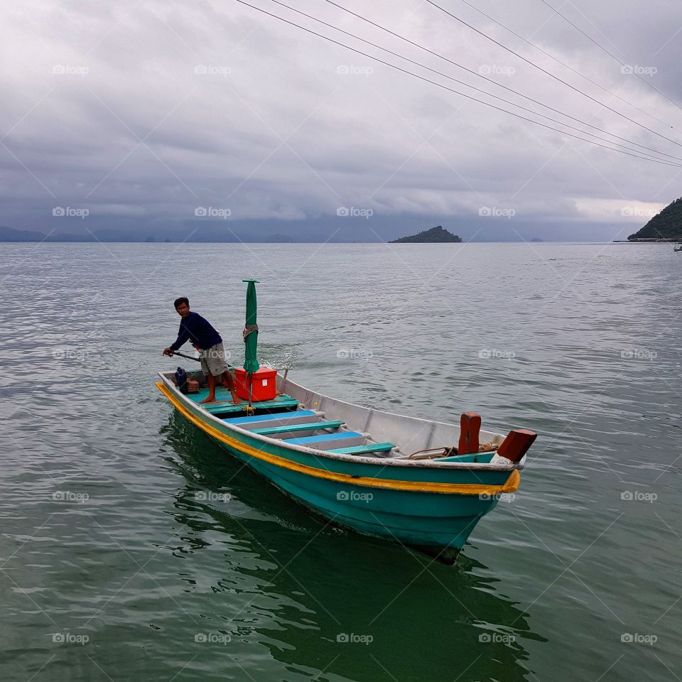 The colorful boat is on the sea