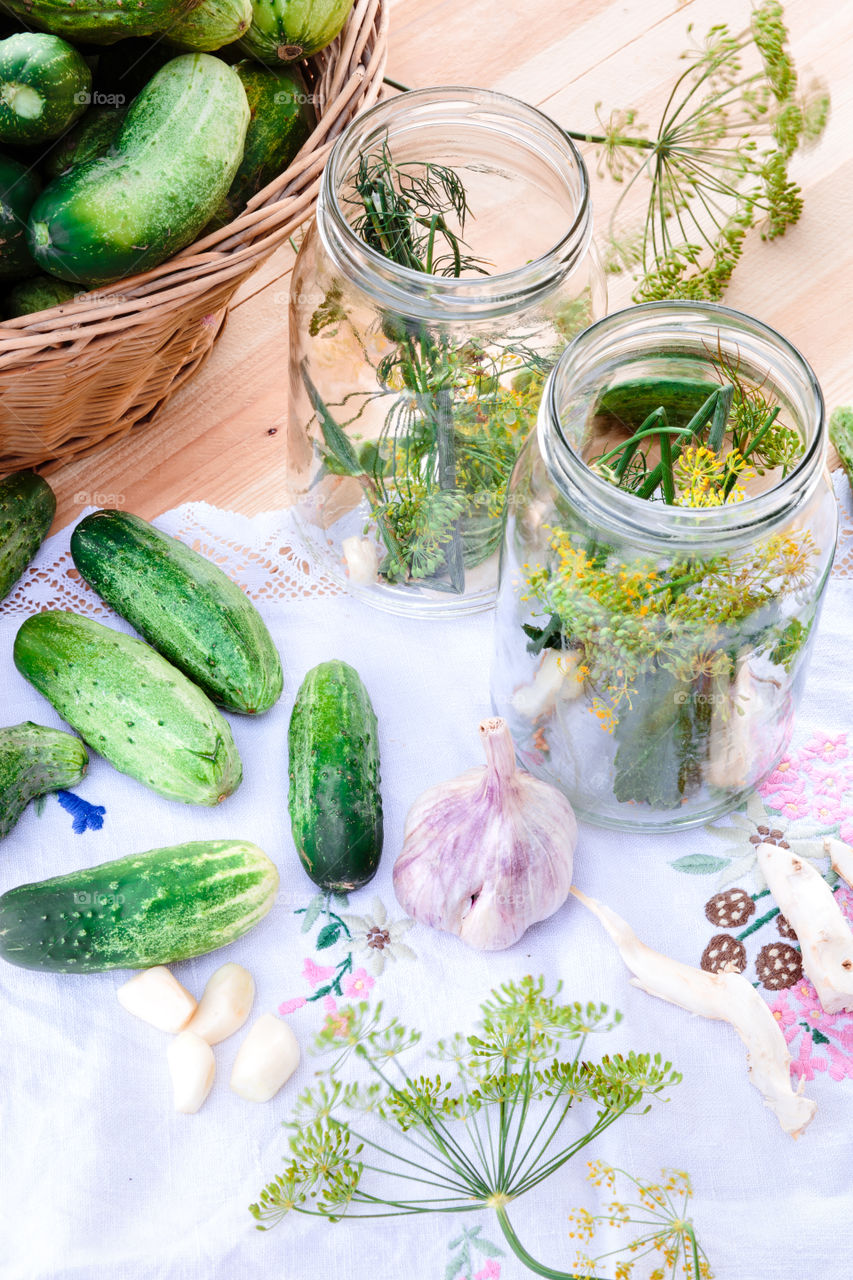 Pickling cucumbers. Pickled cucumbers made with home garden vegetables and herbs