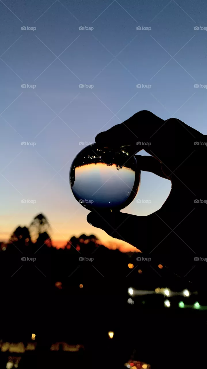 Sao Paulo, Brazil - April,2021: sunset view through a glass ball. 