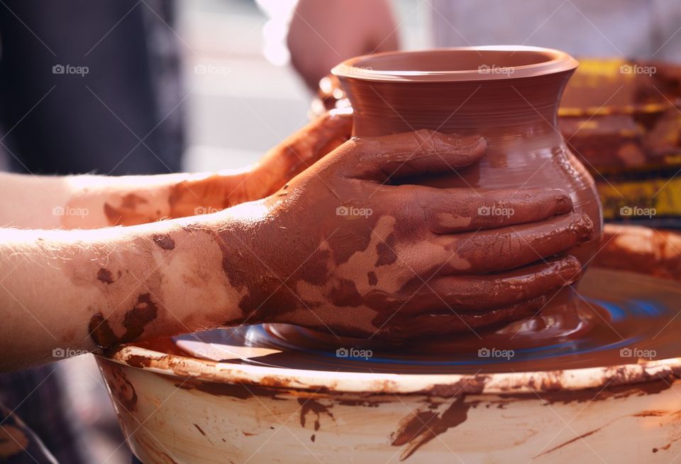 Person making brown pot