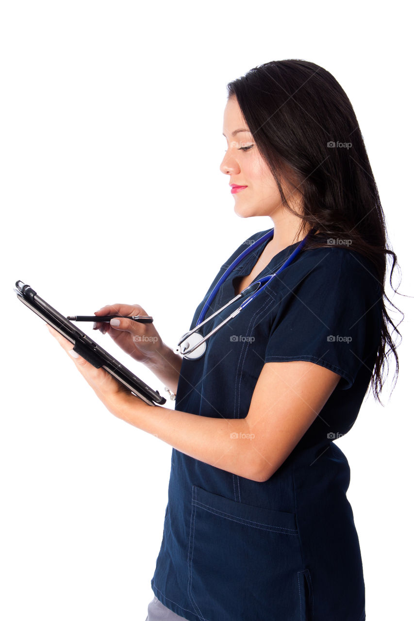 Nurse doctor taking notes on tablet