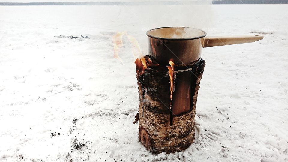Middle of nowhere, Sweden fireplace boilimg water inside for coffe. Cold winter didnt stop us from camping.