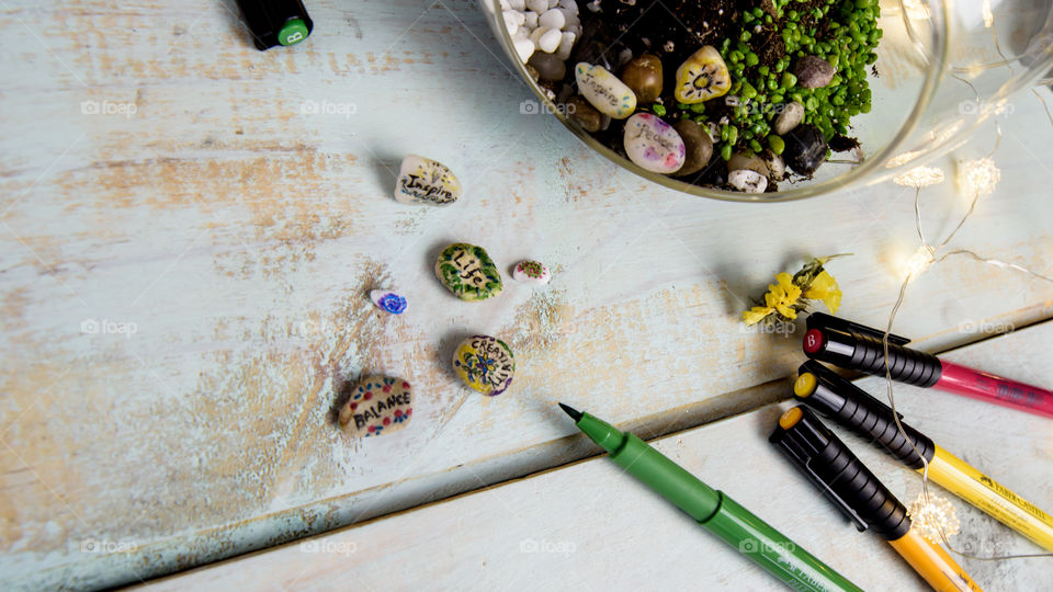 Little things: Creativity in life symbolic stones with inspiring creative messages written and decorated with Faber-Castell fine artist pens to put in cactus garden at home 