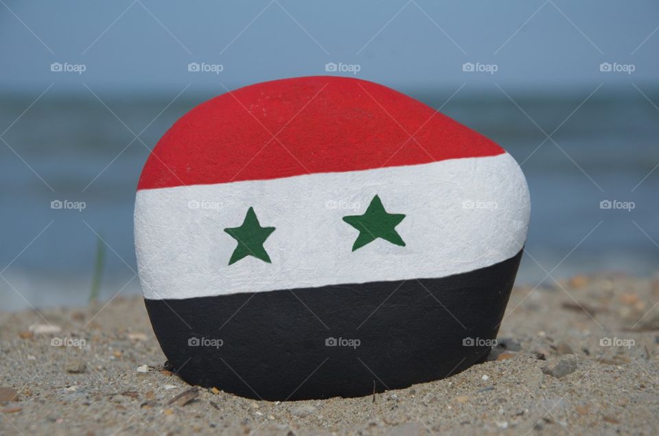 Flag of Syria on a colourful stone