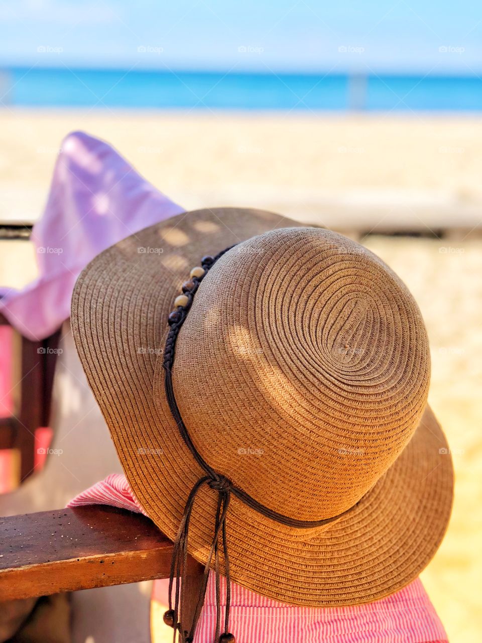 Hat on a chair at the beach 