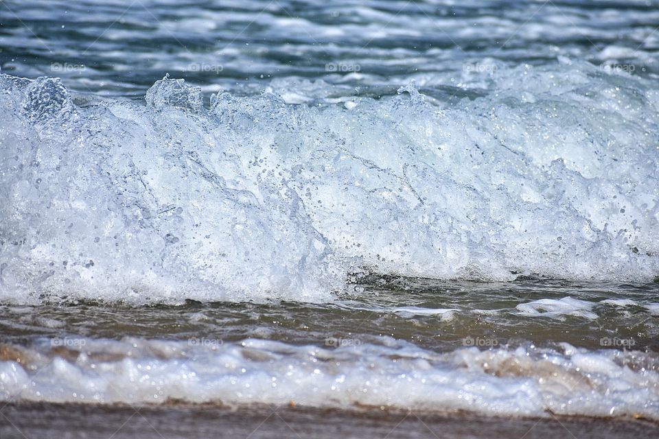 Smooth waves peacefully coming into shore. Taken with a Nikon D3400 at North Carolina outer banks.