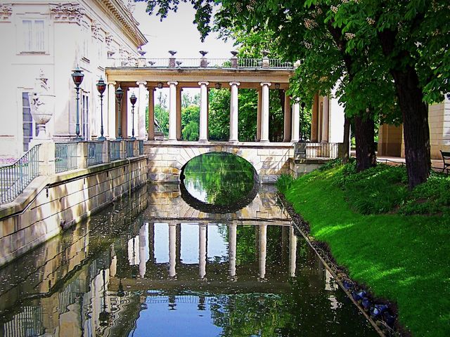 Lazienski Royal Residence Park and palace: A beautiful reflecting pool in the gardens at the palace where I took my American college students on a study abroad tour of Poland