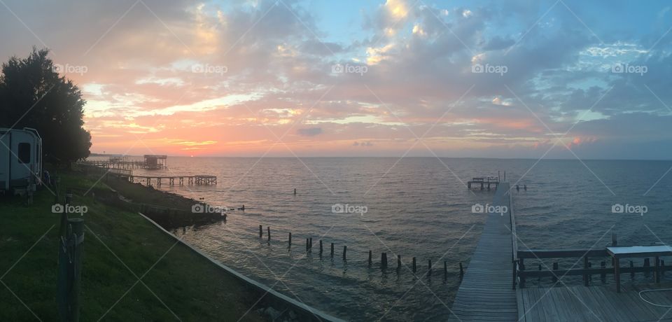 Dock in Gulf Shores, AL at sunset. 