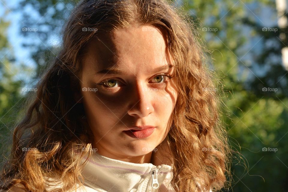 young girl beautiful portrait in sunlight