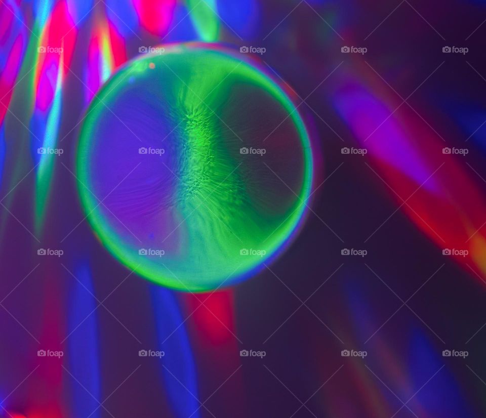 Coloured lights shone through a lens ball