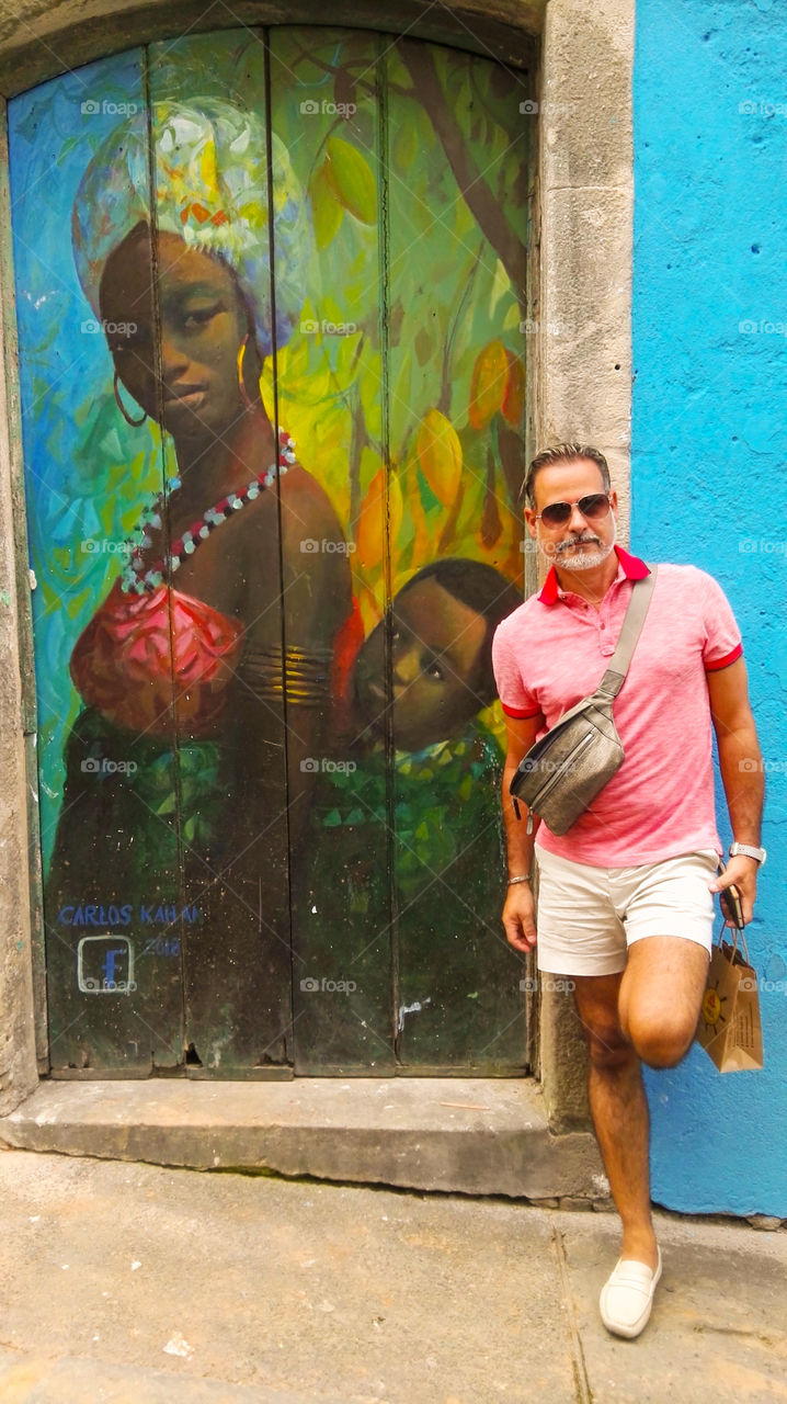 Brazilian man and Salvador street art . 