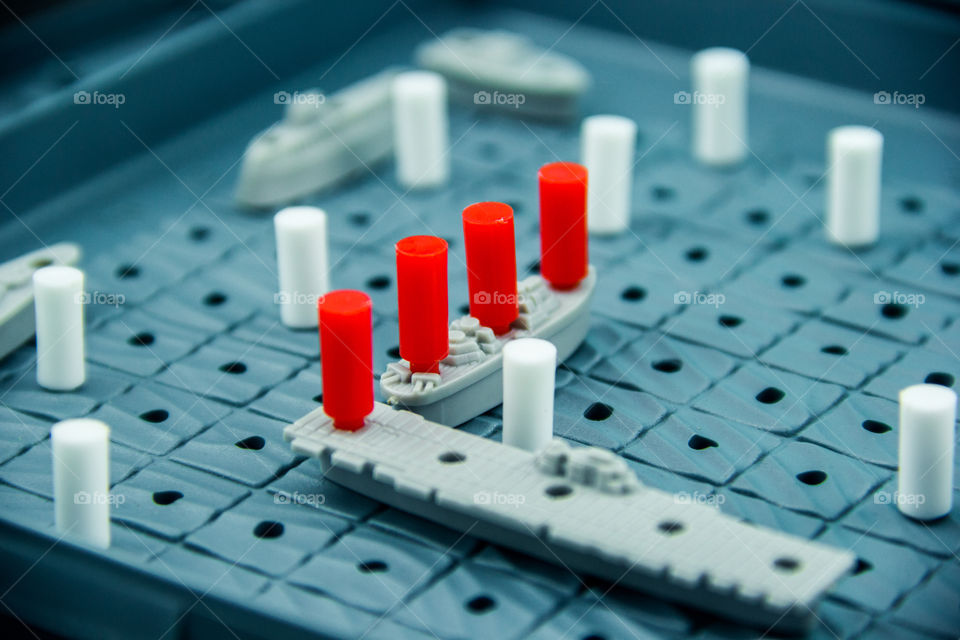 A close-up of the strategic board game of Battleship.