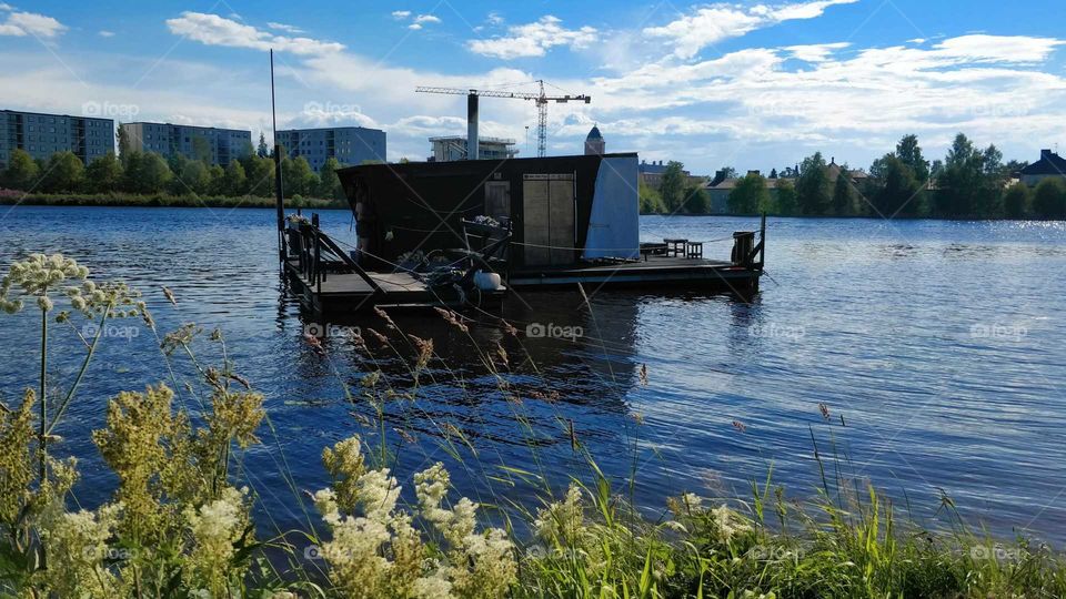 Floating sauna on a river in Oulu, Finland