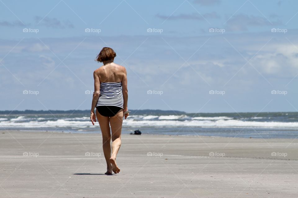 Woman walking on the beach