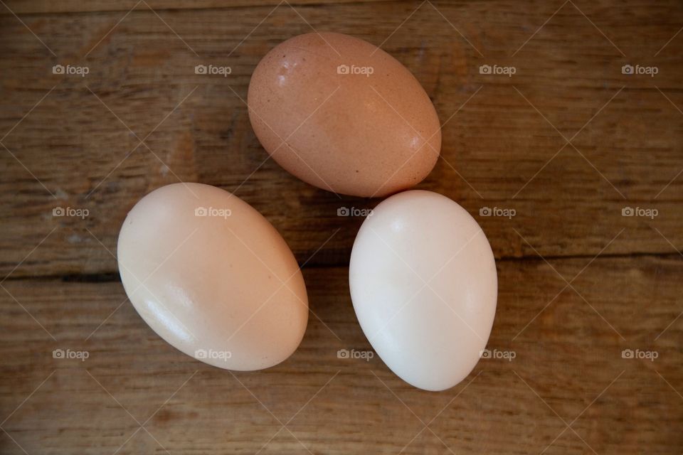 Ecological egg fr.o.m. Small scale local farmers. Tree egg on a wooden board