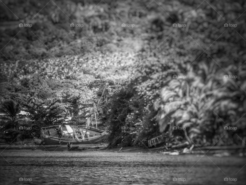 A monochromatic shot of an old fishing boat 