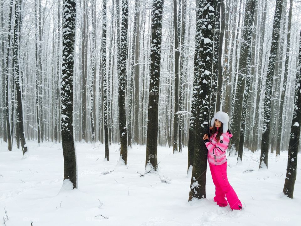 Woman in magical Forest during winter