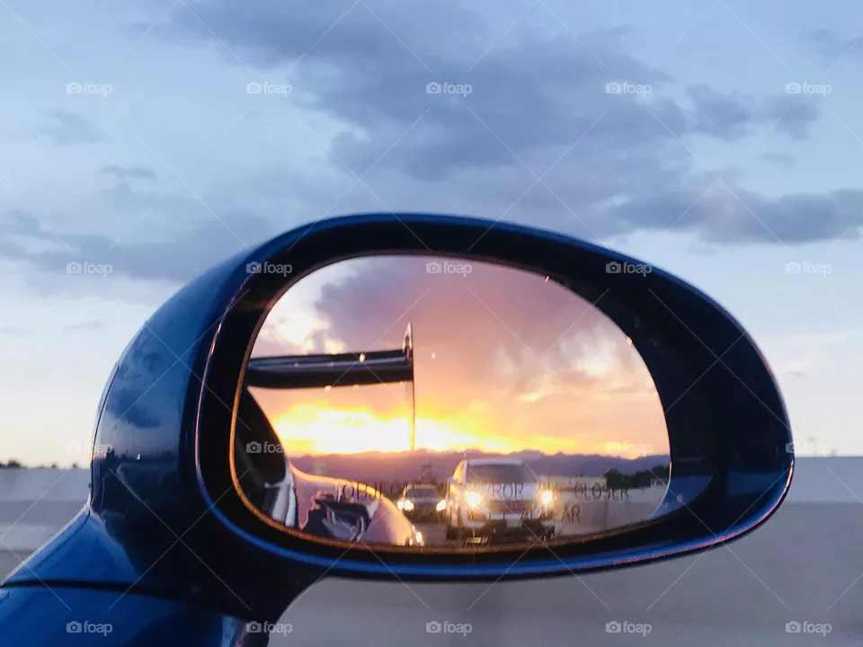 Gorgeous Colorado Sunset through side view mirror in sports car Viper ACR Extreme 