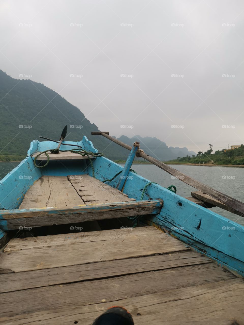 Misty boat ride up vietnaise river