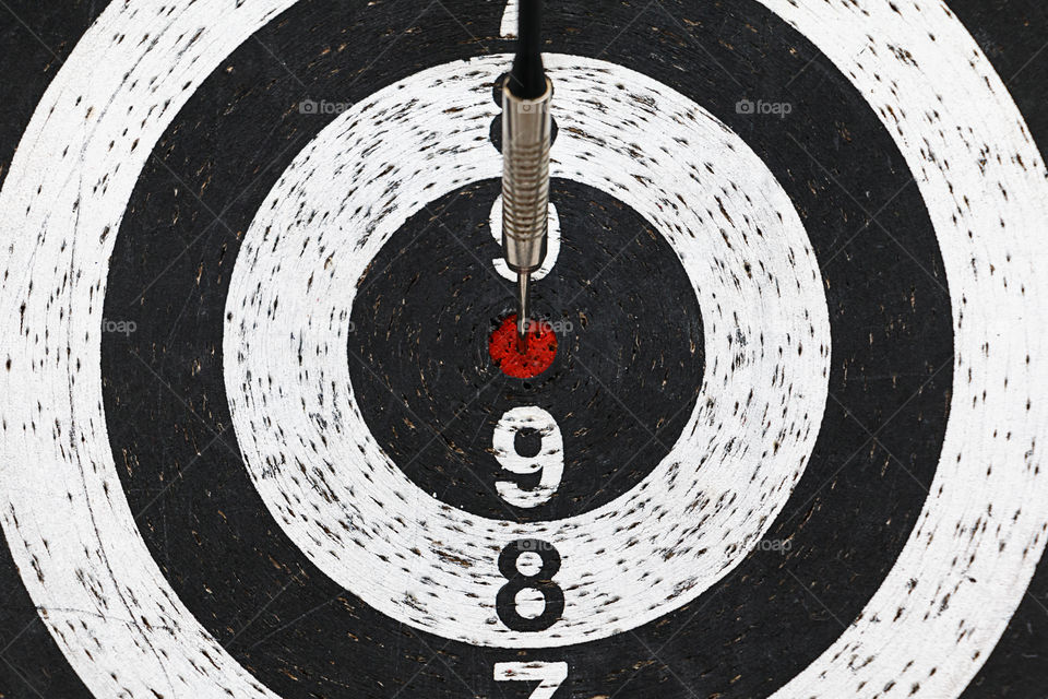 Close-up of dart on bulls-eye