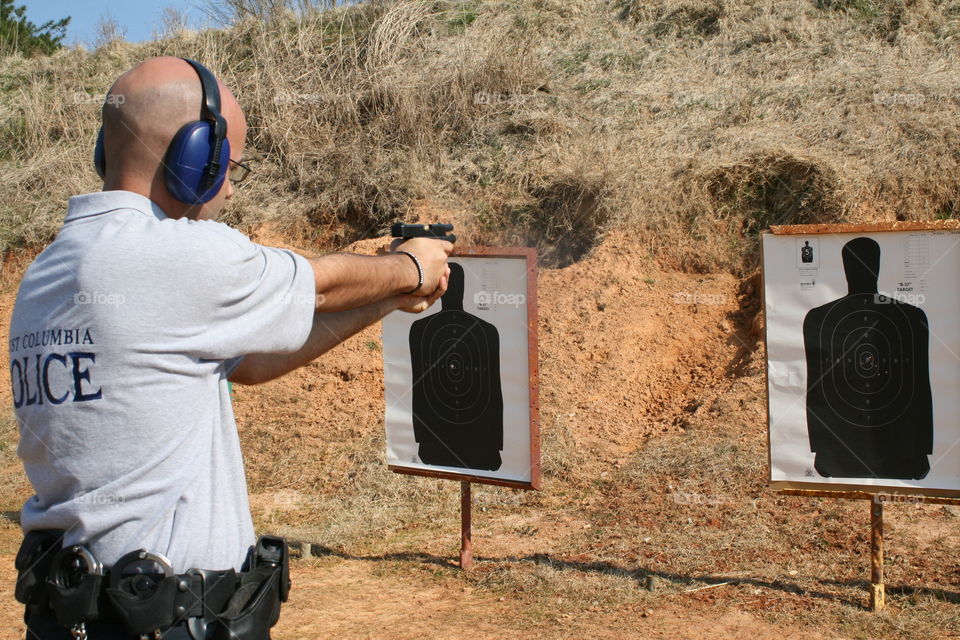 Police officer at firearms range